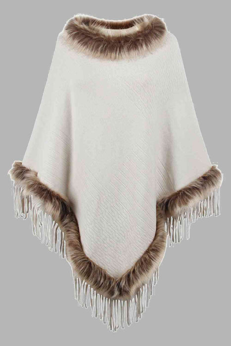 Stylish poncho features faux fur trim