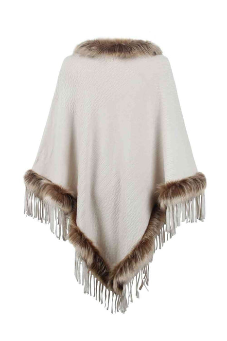 Stylish poncho features faux fur trim