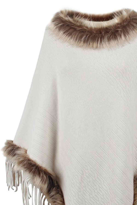 Stylish poncho features faux fur trim