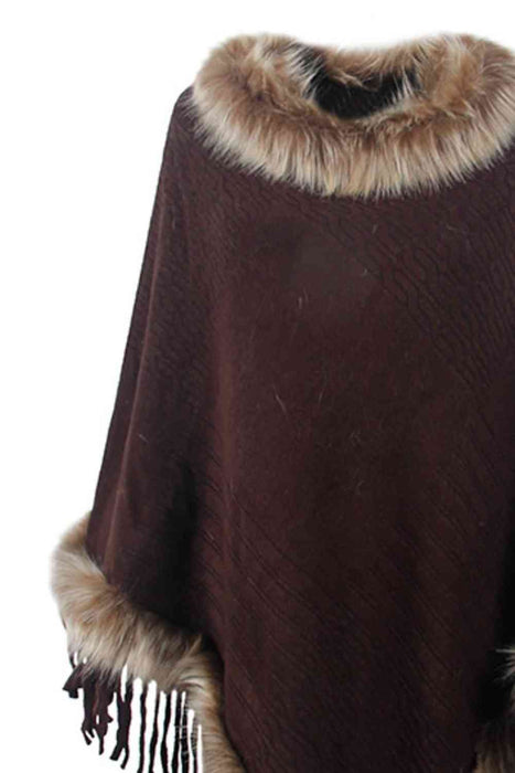 Stylish poncho features faux fur trim