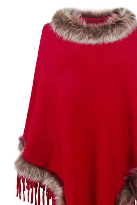 Stylish poncho features faux fur trim